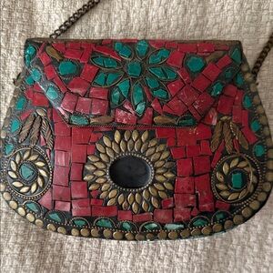 This item is a handmade metal mosaic clutch bag, an ethnic and bohemian-style